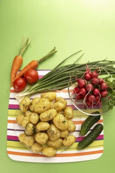 vegetarian still life: boiled new potatoes and fresh vegetables