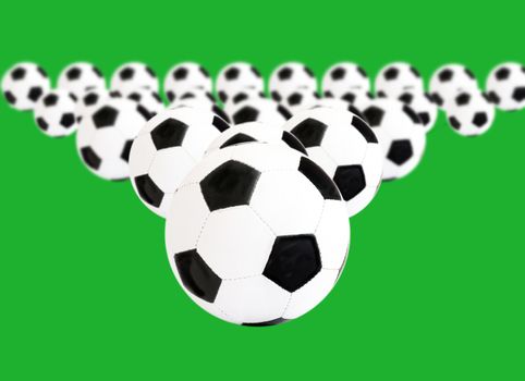 blackly white foot balls on green background