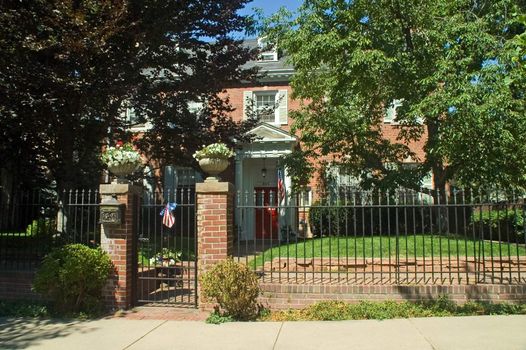 A historical mansion in Denver's wealthy country club district greets passers by