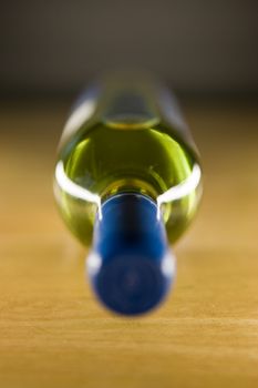 Unopened wine bottle on a wooden table