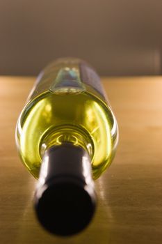 Unopened wine bottle on a wooden table