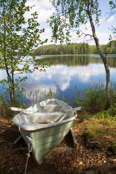 Rowboat stranded ashore at a lake in Finland