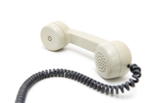 Old telephone on a white background