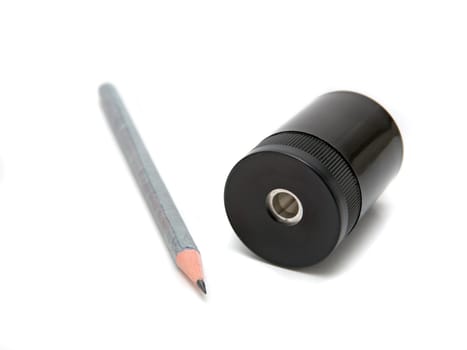 Sharpener and pen on a white background