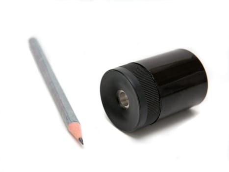 Sharpener and pen on a white background