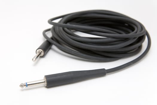 Guitar cable on a white background