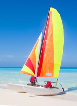 Catamaran on a beautiful beach in the caribbean.
