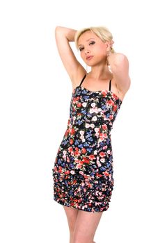 Girl in a flowery summer dress on a white background.