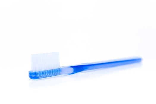 Blue toothbrush on a white background