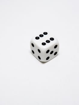 Single die on white showing number six