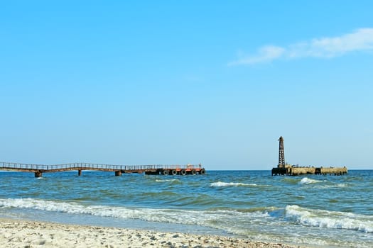 An old sea pier in fine summer day