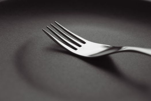 Fork on an empty saucer