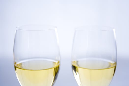 White wine poured in two wine glasses