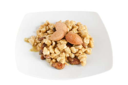 chicken with almonds and curry sauce isolated on white with clipping path