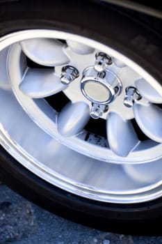Close up view of the detail of a wheel from a car.
