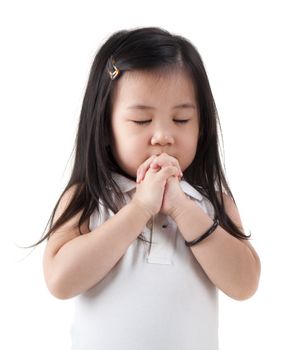 Little girl praying on white background