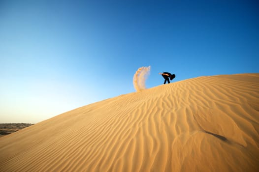 Woman enjoying the desert in Dubai, United Arab Emirates