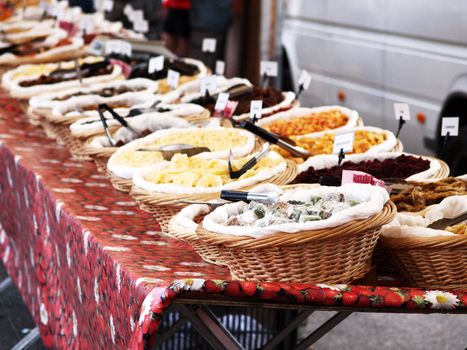 Fresh and dry fruit placed in baskets, onto a table outdoors