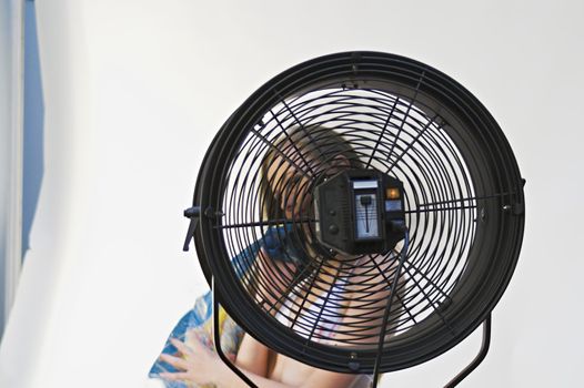 Girl Behind Fan, with Face Unclear