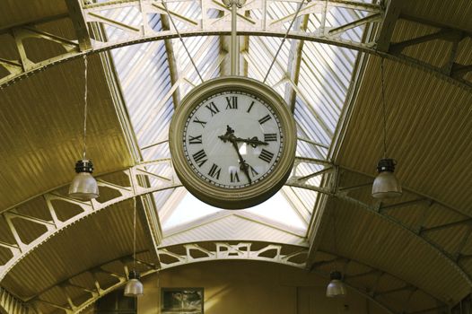 Big hanging public clocks in a railroad station hall, Vitebsk Railroad Station, Saint Petersburg, Russia.
