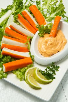 crab salad with fresh lettuce and cocktail sauce