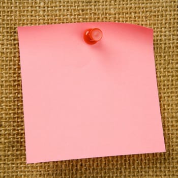 Sticky note attached to bulletinboard