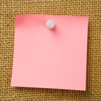 Sticky note attached to bulletinboard