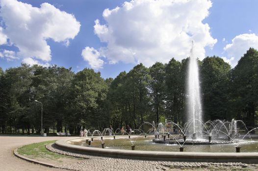 Fountains in a summer park on  a sunny day.