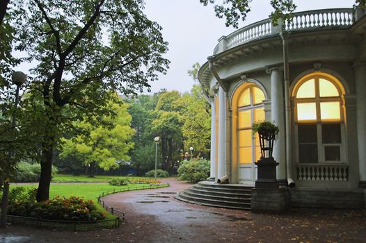 A palace in an early autumn park at evening in Saint Petersburg, Russia.