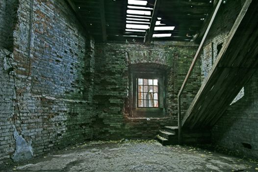Abandoned store house hall with staircase.