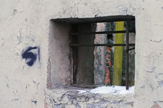 A corroded wall in a back alley.