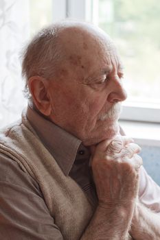 portrait of an old man thinking 