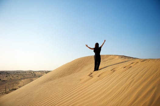 Woman enjoying the desert in Dubai, United Arab Emirates