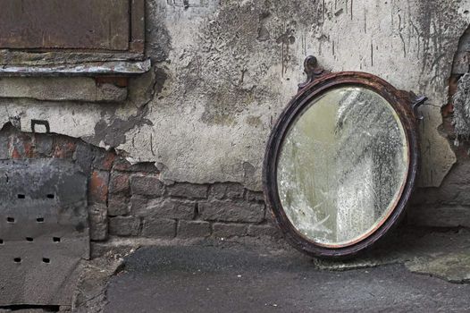 Old Mirror Standing Against Wall