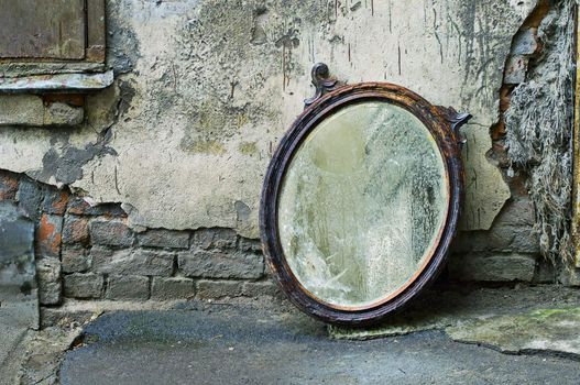 Old Mirror Standing Against Wall