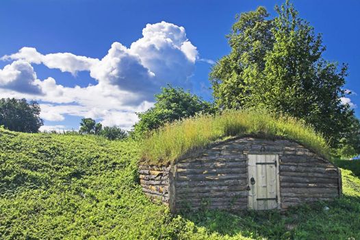 Ancient earth house near medieval Russian fortress