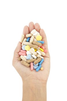 pills in hand isolated on white background