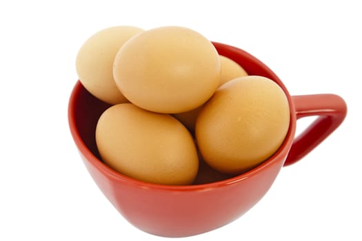 brown eggs in red bowl on white background