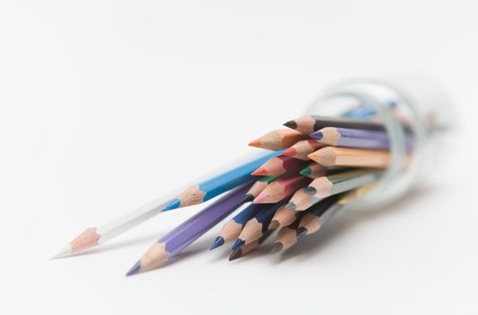 Colored pencils in a glass jar