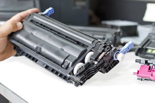 hand holding laser toner cartridge