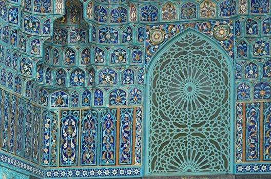 Fragment of a tiled wall with Arabic mosaic of an ancient mosque in Saint Petersburg, Russia.