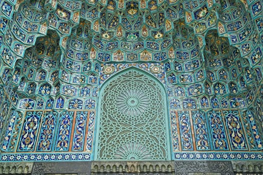 Fragment of a tiled wall with Arabic mosaic of an ancient mosque in Saint Petersburg, Russia.