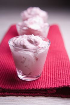 Pudding desserts in small glasses on a table