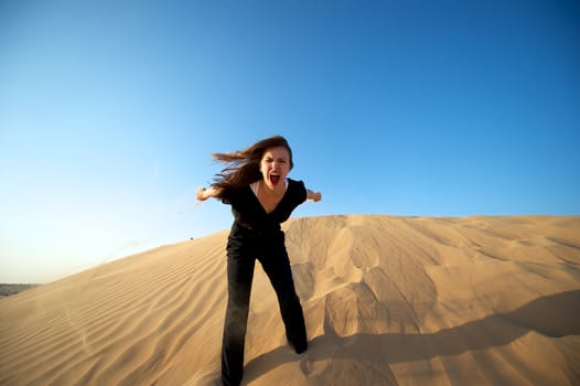 Woman enjoying the desert in Dubai, United Arab Emirates