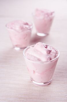 Pudding desserts in small glasses on a table