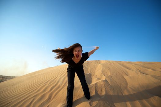 Woman enjoying the desert in Dubai, United Arab Emirates