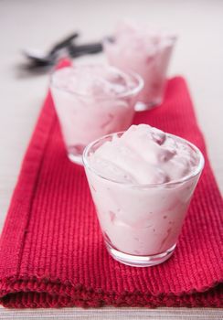 Pudding desserts in small glasses on a table