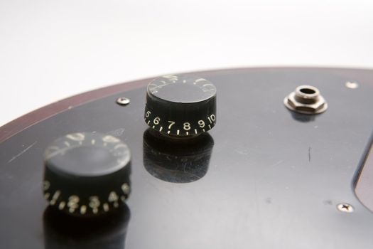 Electric bass guitar adjusting knobs