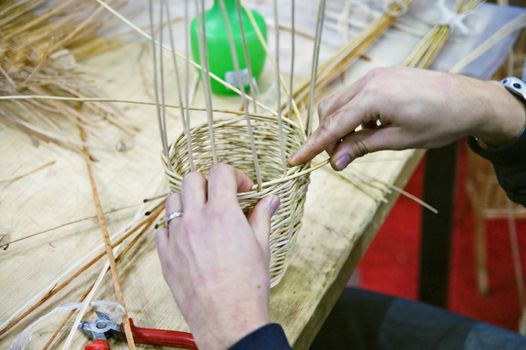 Boy doing traditional crafting work of basketry