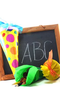 many colorful school cones filled with candy on a School board